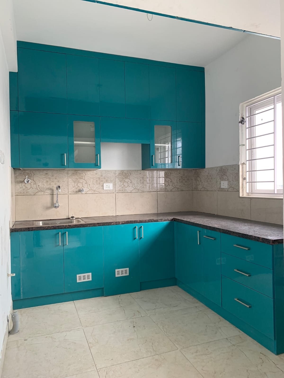 Teal high-gloss modular kitchen